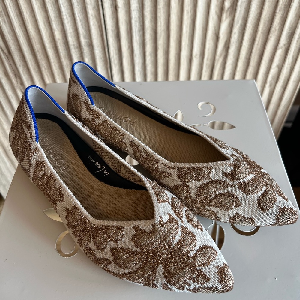 These are Rothy's The Point II flats in the Gold Chantilly colorway.